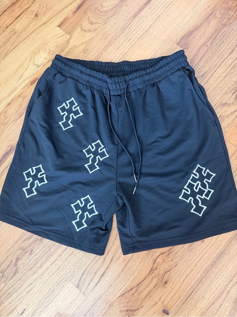 ROMWE Black Athletic Shorts with White Cross Graphics
